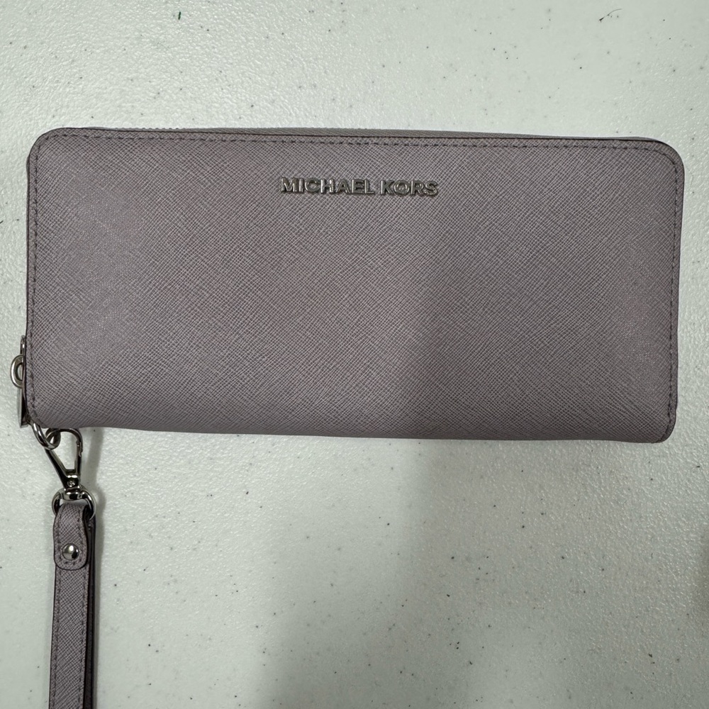 Michael Kors purple wallet.